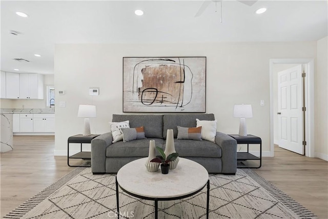 3876 Olmsted Ave, Los Angeles, CA 90008 - living area featuring light wood-type flooring, recessed lighting, and ceiling fan