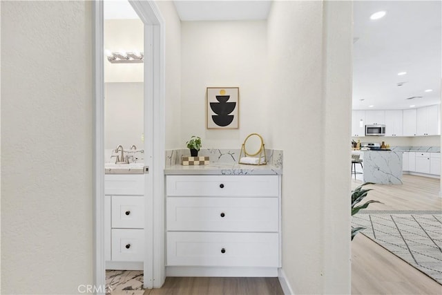 3876 Olmsted Ave, Los Angeles, CA 90008 - hall with light wood-style flooring and recessed lighting