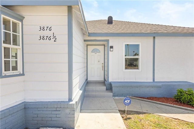 3876 Olmsted Ave, Los Angeles, CA 90008 - view of exterior entry featuring roof with shingles