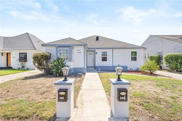 3876 Olmsted Ave, Los Angeles, CA 90008 - view of front of home featuring a front yard and roof with shingles