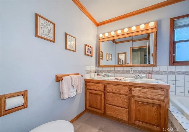 17213 Horace St, Granada Hills, CA 91344 - bathroom featuring crown molding, double vanity, tiled bath, backsplash, and tile patterned floors