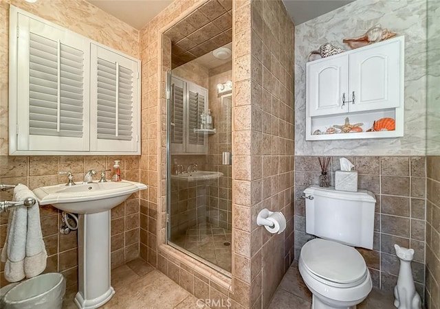 17213 Horace St, Granada Hills, CA 91344 - bathroom with tile walls, a stall shower, and tile patterned floors