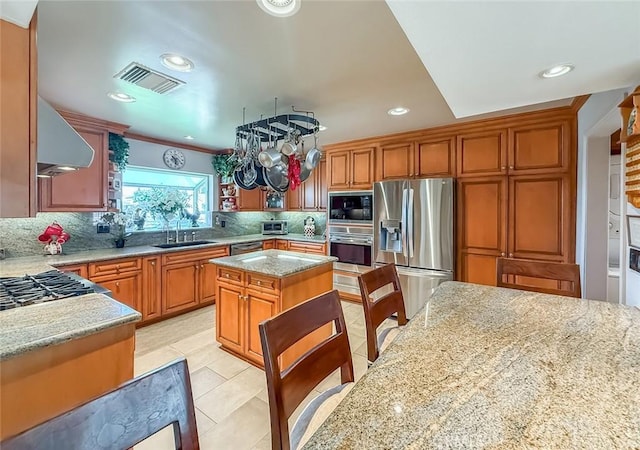 17213 Horace St, Granada Hills, CA 91344 - kitchen featuring appliances with stainless steel finishes, exhaust hood, backsplash, light stone countertops, and light tile patterned flooring