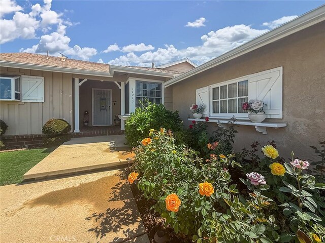 17213 Horace St, Granada Hills, CA 91344 - property entrance featuring board and batten siding and stucco siding
