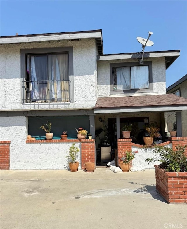 1239 W Rosecrans, Gardena, CA 90247 - view of front of property with stucco siding and a patio