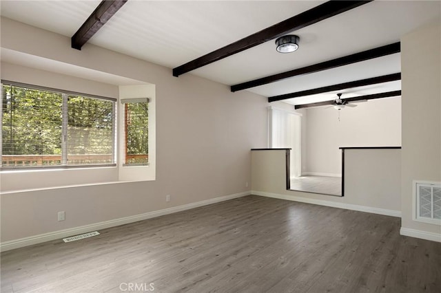 833 E Victoria, Lake Arrowhead, CA 92352 - unfurnished living room featuring beamed ceiling, wood finished floors, and a ceiling fan