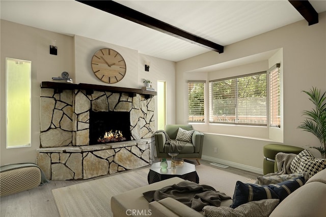833 E Victoria, Lake Arrowhead, CA 92352 - living room featuring beamed ceiling, healthy amount of natural light, wood finished floors, and a fireplace