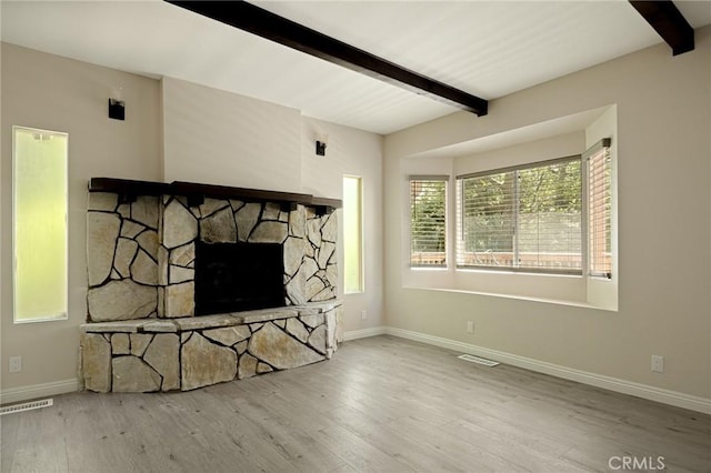 833 E Victoria, Lake Arrowhead, CA 92352 - unfurnished living room with beam ceiling, plenty of natural light, and wood finished floors