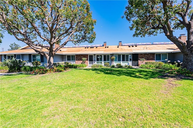 1209 E 1st St, Tustin, CA 92780 - single story home featuring a front lawn, brick siding, and a chimney