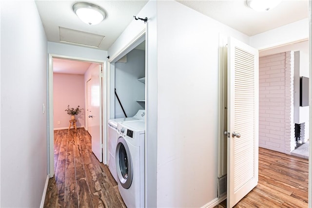 1209 E 1st St, Tustin, CA 92780 - washroom featuring independent washer and dryer, wood finished floors, and attic access