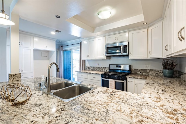 1209 E 1st St, Tustin, CA 92780 - kitchen featuring stainless steel appliances, white cabinetry, and light stone countertops