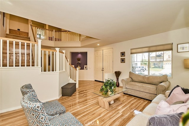 13637 Aspen Leaf Ln, Eastvale, CA 92880 - living area featuring stairs and wood finished floors