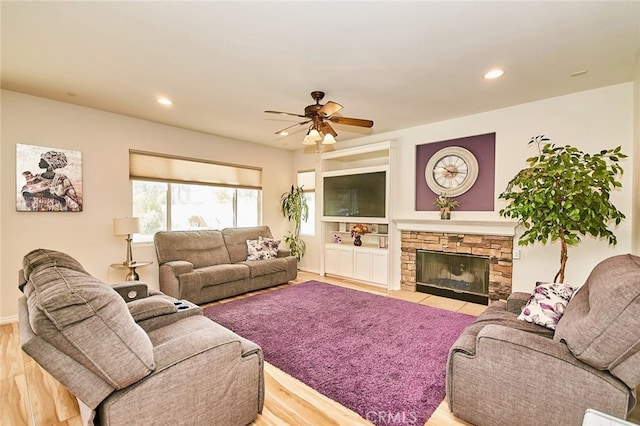 13637 Aspen Leaf Ln, Eastvale, CA 92880 - living room featuring wood finished floors, a ceiling fan, recessed lighting, and a fireplace