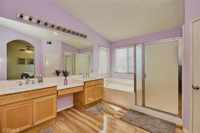 13637 Aspen Leaf Ln, Eastvale, CA 92880 - bathroom with a shower stall, vaulted ceiling, a bath, double vanity, and connected bathroom