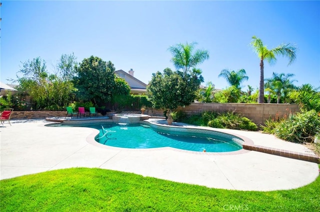 13637 Aspen Leaf Ln, Eastvale, CA 92880 - view of pool featuring a patio, a fenced backyard, and a pool with connected hot tub