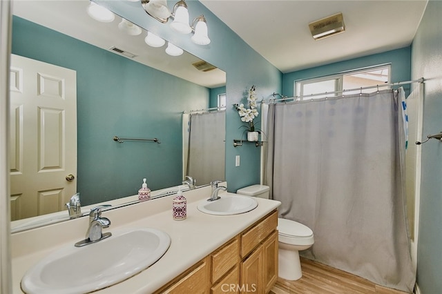 13637 Aspen Leaf Ln, Eastvale, CA 92880 - full bath featuring wood finished floors, double vanity, and a shower with shower curtain