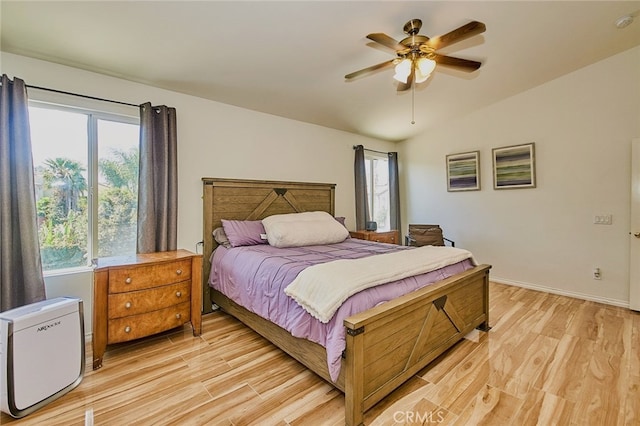 13637 Aspen Leaf Ln, Eastvale, CA 92880 - bedroom with light wood-style flooring, vaulted ceiling, and ceiling fan