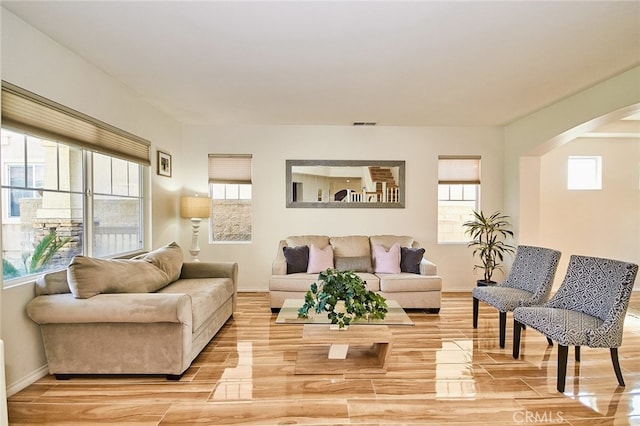 13637 Aspen Leaf Ln, Eastvale, CA 92880 - living area with arched walkways and light wood finished floors