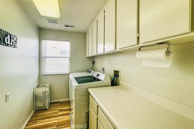 13637 Aspen Leaf Ln, Eastvale, CA 92880 - laundry area featuring cabinet space, washer and clothes dryer, and dark wood-type flooring