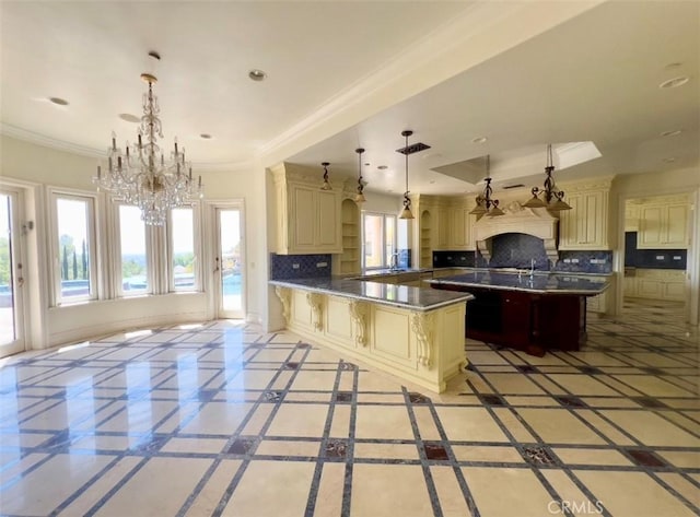 119 Furlong Ln, Bradbury, CA 91008 - kitchen featuring cream cabinetry, a chandelier, decorative backsplash, dark countertops, and crown molding