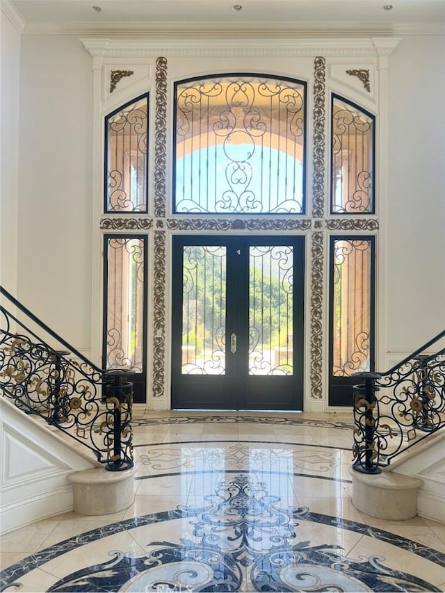 119 Furlong Ln, Bradbury, CA 91008 - entryway with inlaid floor details, stairs, ornamental molding, marble tiled flooring, and a high ceiling