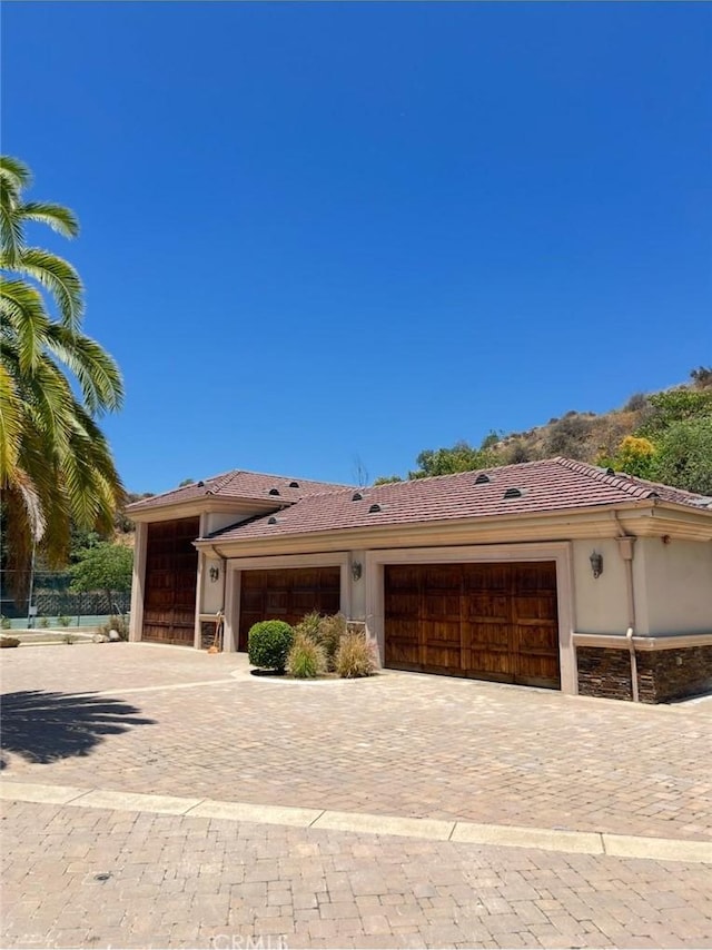 119 Furlong Ln, Bradbury, CA 91008 - single story home with a garage, decorative driveway, stucco siding, and a tile roof
