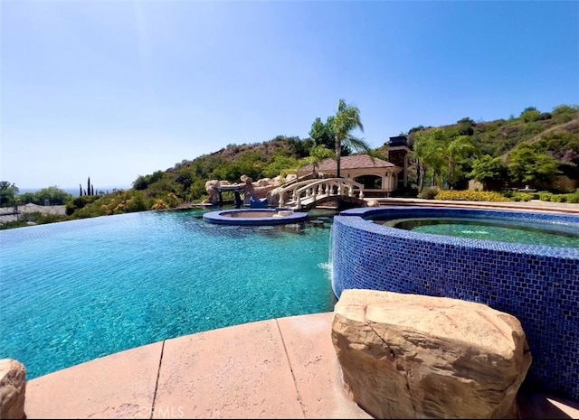 119 Furlong Ln, Bradbury, CA 91008 - view of swimming pool featuring a pool with connected hot tub