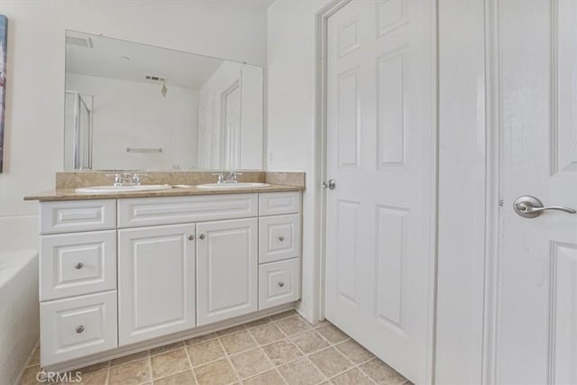 16202 Orion Ave, Chino, CA 91708 - bathroom featuring double vanity, an enclosed shower, and a tub to relax in