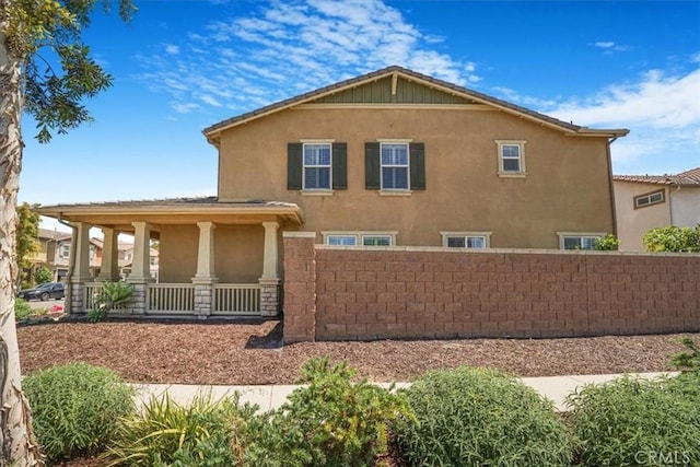 16202 Orion Ave, Chino, CA 91708 - back of house with stucco siding, a porch, and stone siding