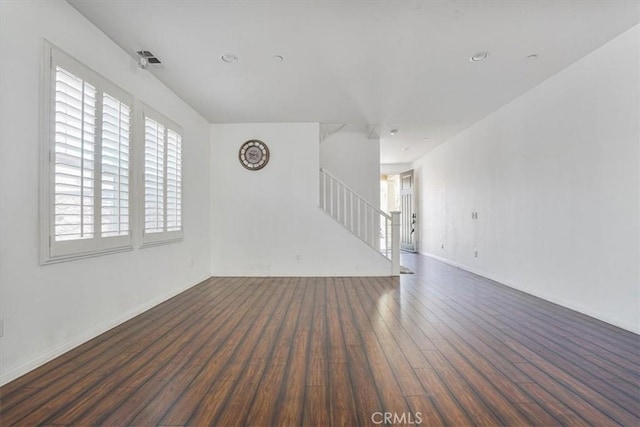 16202 Orion Ave, Chino, CA 91708 - unfurnished living room featuring stairway, wood finished floors, and healthy amount of natural light