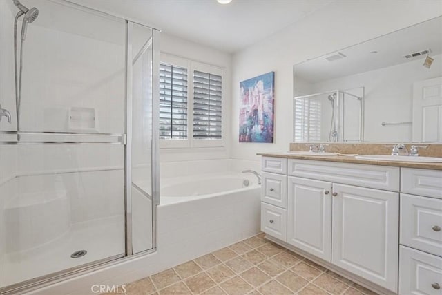 16202 Orion Ave, Chino, CA 91708 - bathroom featuring a stall shower, double vanity, and a garden tub