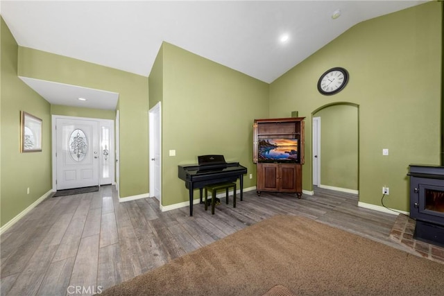 5935 Monte Vista Rd, Phelan, CA 92371 - entryway featuring a wood stove, wood finished floors, and high vaulted ceiling