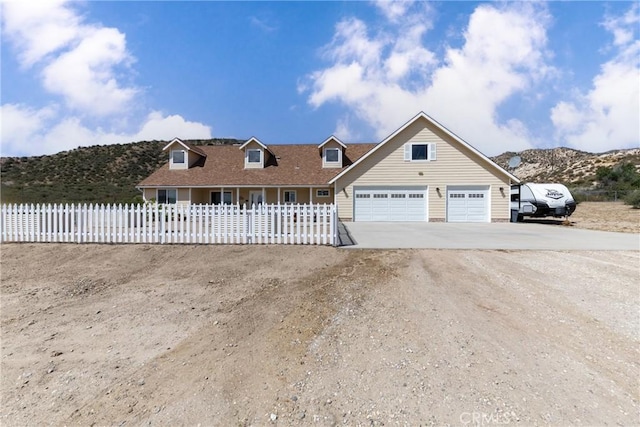 5935 Monte Vista Rd, Phelan, CA 92371 - view of front facade featuring concrete driveway, a garage, and a mountain view