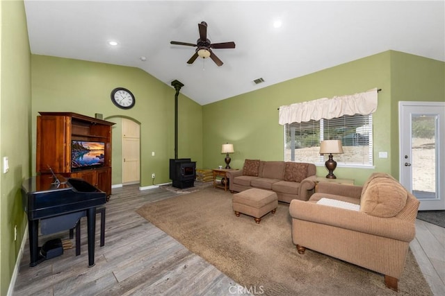 5935 Monte Vista Rd, Phelan, CA 92371 - living area with ceiling fan, wood finished floors, a wood stove, and vaulted ceiling