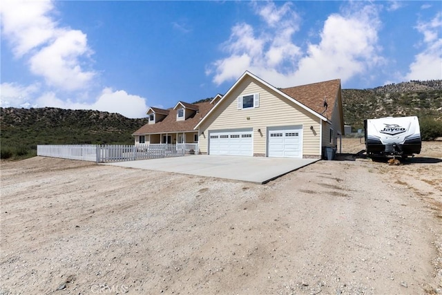 5935 Monte Vista Rd, Phelan, CA 92371 - view of property exterior featuring driveway, a garage, and a mountain view