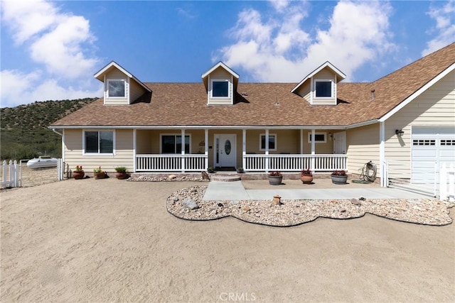 5935 Monte Vista Rd, Phelan, CA 92371 - view of front of home with covered porch, a shingled roof, and a garage