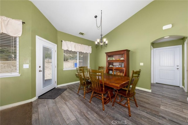 5935 Monte Vista Rd, Phelan, CA 92371 - dining area with arched walkways, a chandelier, wood finished floors, and high vaulted ceiling