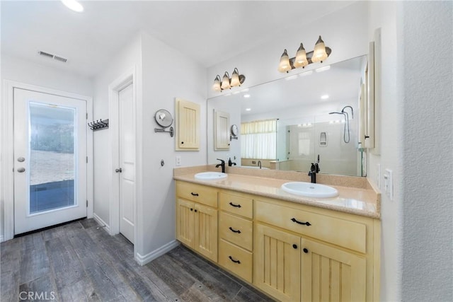 5935 Monte Vista Rd, Phelan, CA 92371 - bathroom featuring double vanity, wood finished floors, and a shower