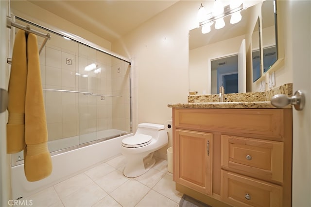 18560 Vanowen St Unit 27, Reseda, CA 91335 - bathroom with bath / shower combo with glass door, vanity, and tile patterned flooring