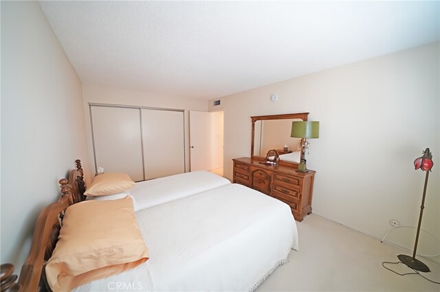 18560 Vanowen St Unit 27, Reseda, CA 91335 - bedroom featuring a closet and light colored carpet