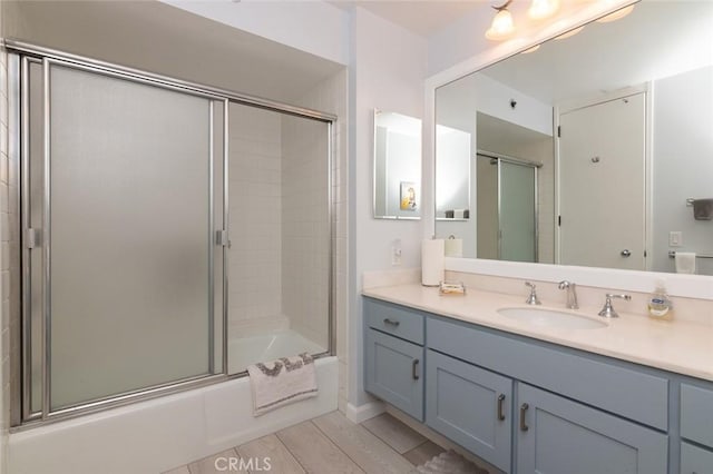 222 Monterey Rd Unit 1205, Glendale, CA 91206 - bathroom with vanity, combined bath / shower with glass door, and wood finished floors
