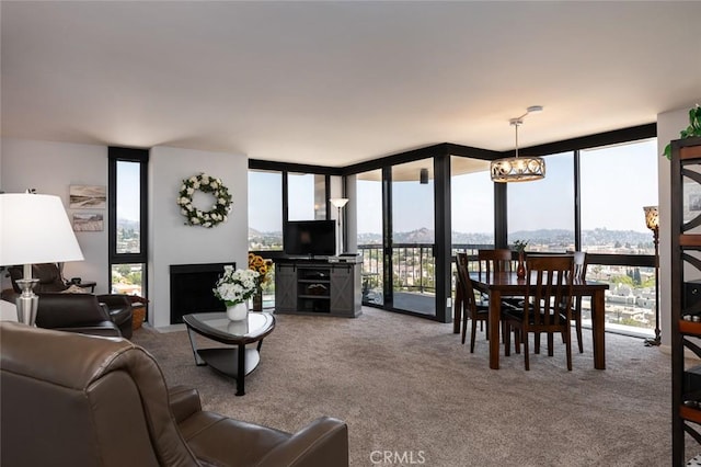 222 Monterey Rd Unit 1205, Glendale, CA 91206 - living area with expansive windows, carpet flooring, and a chandelier