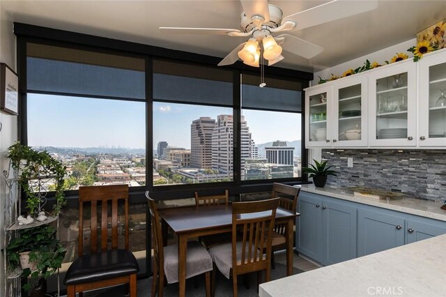 222 Monterey Rd Unit 1205, Glendale, CA 91206 - dining area featuring healthy amount of natural light, a ceiling fan, and a view of city
