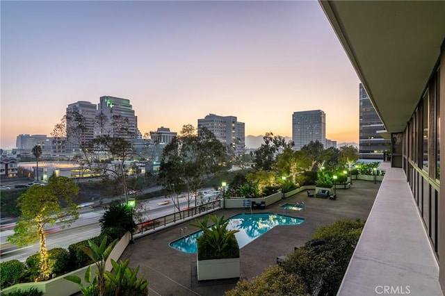 222 Monterey Rd Unit 1205, Glendale, CA 91206 - pool at dusk with a skyline view and a community pool