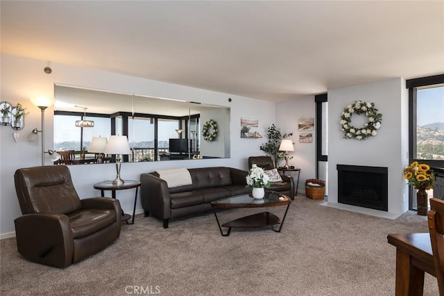 222 Monterey Rd Unit 1205, Glendale, CA 91206 - carpeted living room with plenty of natural light and a fireplace with flush hearth