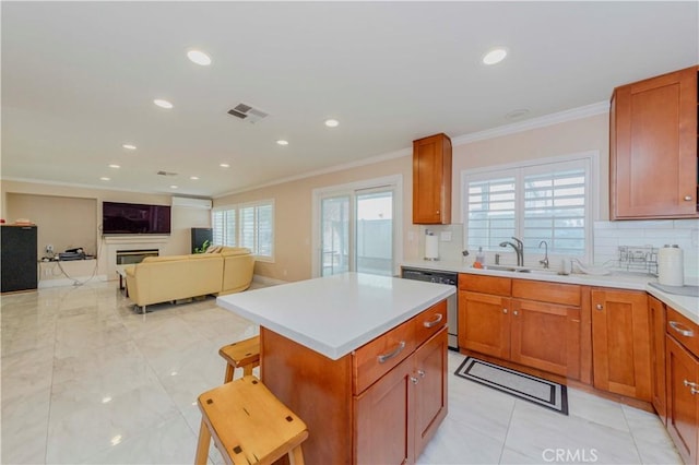 1528 W Delvale St, West Covina, CA 91790 - kitchen featuring stainless steel dishwasher, ornamental molding, light countertops, backsplash, and a kitchen island