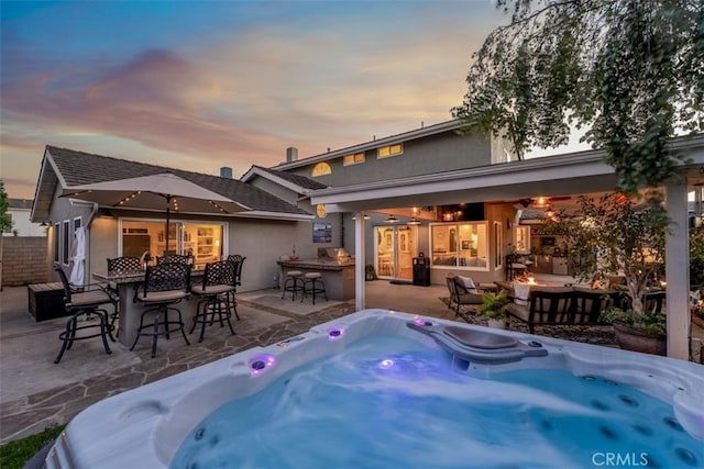 20072 Mural Cir, Huntington Beach, CA 92646 - view of swimming pool featuring an outdoor fire pit, a hot tub, and a patio