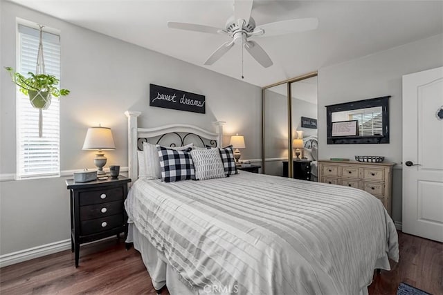 20072 Mural Cir, Huntington Beach, CA 92646 - bedroom featuring wood finished floors, multiple windows, a closet, and a ceiling fan