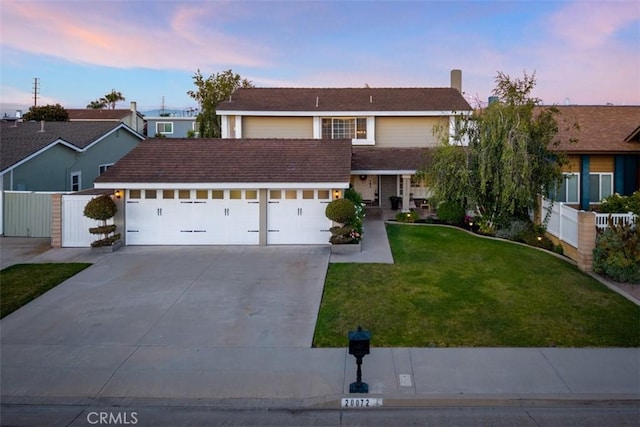 20072 Mural Cir, Huntington Beach, CA 92646 - view of front of home with concrete driveway and an attached garage