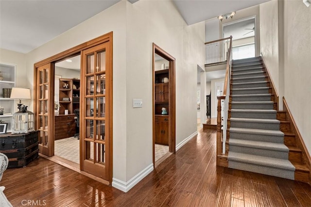 20072 Mural Cir, Huntington Beach, CA 92646 - foyer entrance featuring stairs and hardwood / wood-style floors